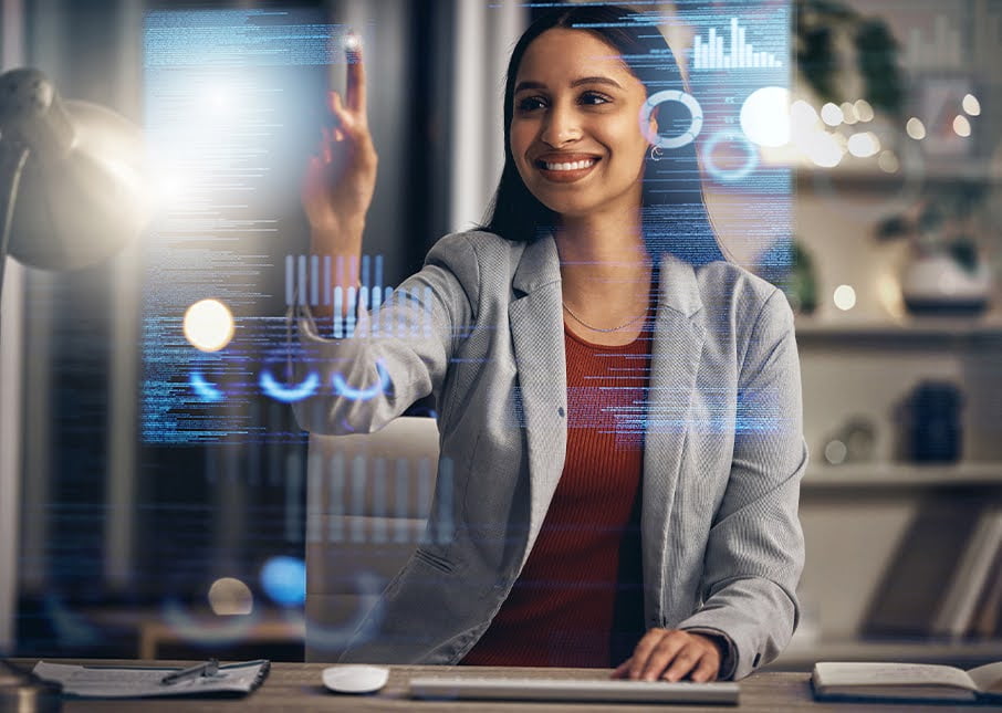 Smiling Woman Engages with Talent Acquisition Data on Virtual Screen
